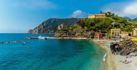 Fototapeta premium A panorama view across the beach towards the headland at Monterosso al Mare, Italy in summer