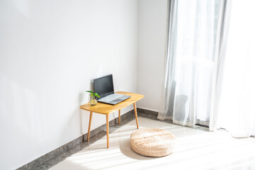 Morning sunlight shines into the corner of the room