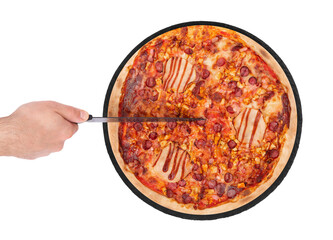 The chef cuts the BBQ pizza with a kitchen knife. Tasty pizza with ham, bbq sauce, bacon and salami on a round slate platter, isolated on white background, top view
