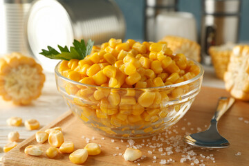 Composition with fresh raw corn on white wooden background, close up