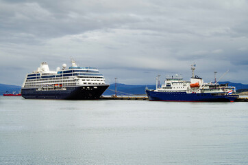 Luxury cruiseship or cruise ship liner and expedition vessel in port of Ushuaia, Patagonia in...