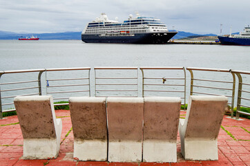 Luxury cruiseship or cruise ship liner and expedition vessel in port of Ushuaia, Patagonia in...