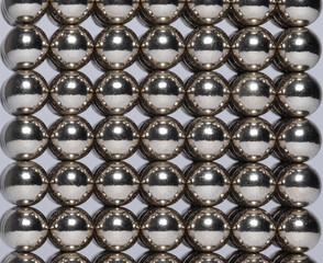 Shiny magnetic silver  ball orb light reflections