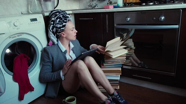 Young woman working at home during quarantine. Professional multitasking person has call. Talking using headphone. Helpdesk remote work