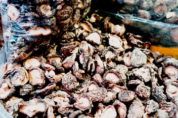Dried Shiitake on a vintage background as detailed close-up shot, selective focus
