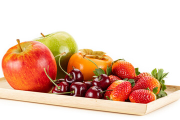 Plate of fresh ripe fruits isolated on a white background.