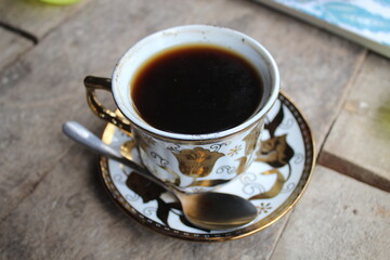 cup of coffee on wooden table