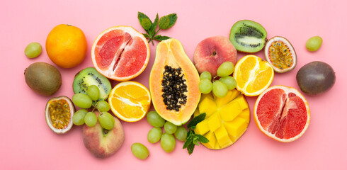 Summer fruits backround. Various fruits on pink background. Summer concept. Banner.