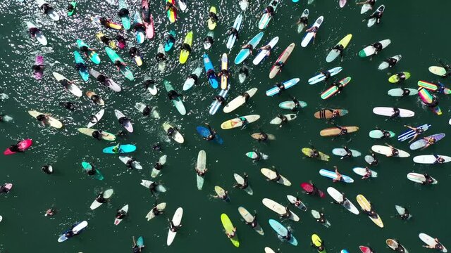 2020 - aerial over surfers in circle during BLM Black Lives Matter Paddle For Freedom gathering in California.