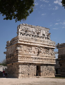 Ancient Mayan ruins the temple with three-dimensional masks of the Maya god of rain chac, at Chichen Itza, Mexico