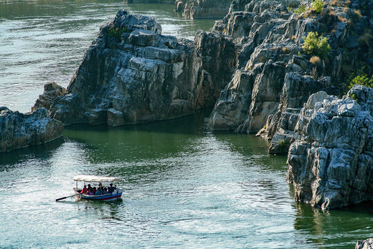 Tourists riding with small boats on Narmada River in Bheraghat, Jabalpur, Madhya Pradesh, INDIA