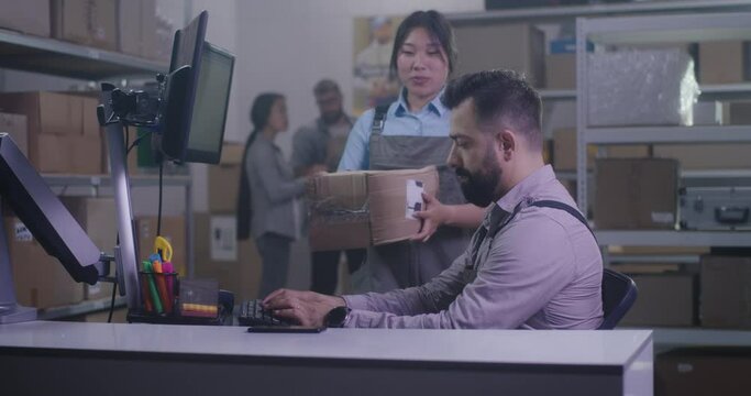 Worker photographing damaged package