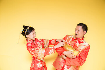 Male and female models in traditional Chinese wedding costumes.