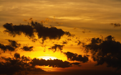Orange sunset. Picturesque dark clouds. Natural background.