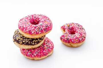 Colorful donuts closeup. Strawberry bakery on white background 