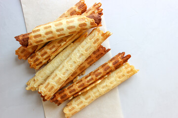 Waffle tubes stacked on a plate