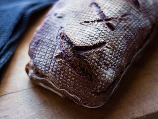 Fototapeta na wymiar Rustic artisanal wholewheat & rye bread loaf