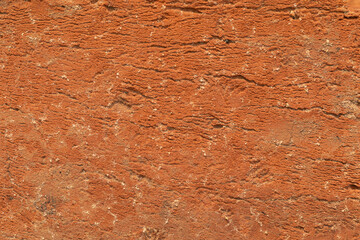 Old cracked clay brick texture. Red brick surface with sand and cement. Beautiful brick texture.