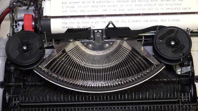 typebars and ribbon spools with type guide of old antique typewriter