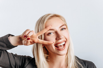 Hey smile you. Portrait of cheeky and cute glamor blond woman combed hair and jacket winking...