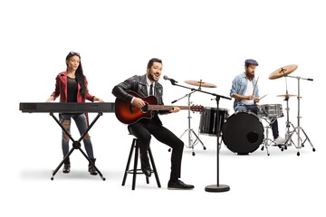 People in a music band with an acoustic guitar, keyboard and drums