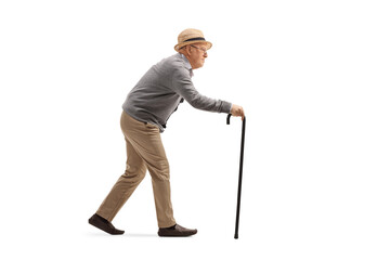Elderly man walking with a walking cane