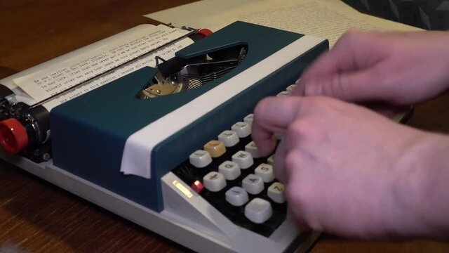 Close view old antique typewriter. someone Typing writing strange stupid text