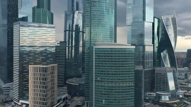 Aerial drone pan shot close up of glass building of Moscow City at daylight. Middle shot of Moscow Business Center buildings