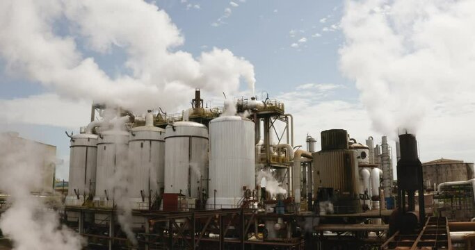 Sugar Cane Refinery / Plant. Beautiful aerial image with the sunlight of the production line of the sugarcane plant - ethanol - Agribusiness.
