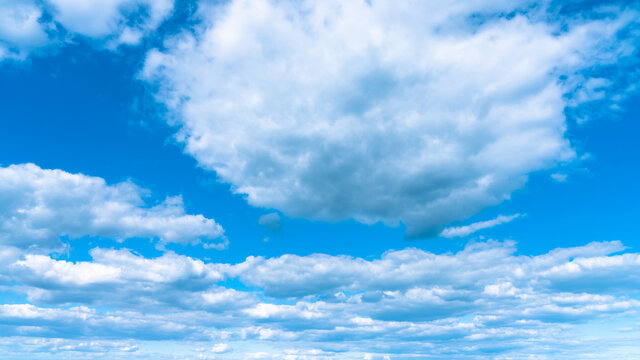 Blue sky with white clouds after a thunderstorm landscape.