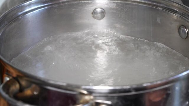 Boiling water in a saucepan and boiling vermicelli
