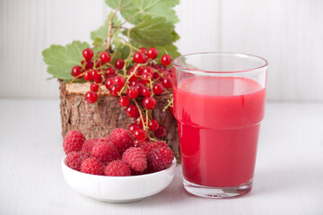 Raspberry-currant drink with raspberries and red currants