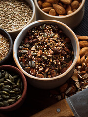 Traditional whole foods, grains, nuts and seeds in rustic, natural light setting with custom made cermics.