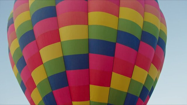 Huge balloon taking off the ground, dreams come true, traveling on balloon, start of adventure