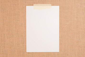 Texture or background of brown sackcloth and white notepad sheet with empty space