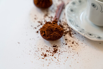 Ground coffee bean in wooden spoon and Turkish coffee