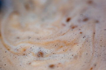 Macro bubbles of black coffee foam