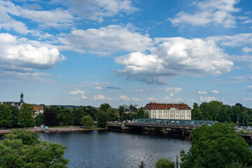 Fototapeta na wymiar Wide angle summer day view of palace castle on river in historical district Köpenick Berlin, Germany popular tourist travel destination