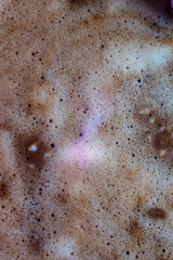 Macro bubbles of black coffee foam
