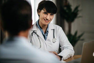 portrait of a female doctor during a consultation with a patient