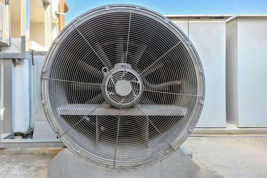 Large fan for ventilation. Industrial air conditioning and ventilation systems on a roof. Closeup industrial ventilation fan