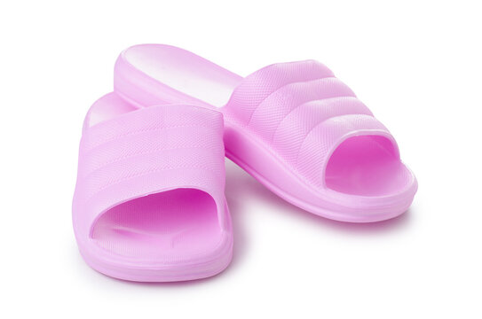 Pink female rubber slippers on white background isolation