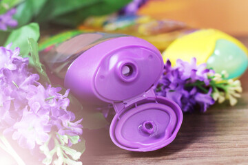 Obraz na płótnie Canvas Shower gel and purple flowers