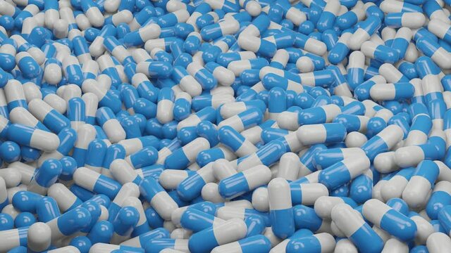 3D rendering Close up of many blue and white capsule pills drugs