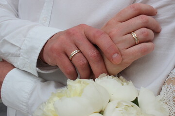 bride and groom holding hands