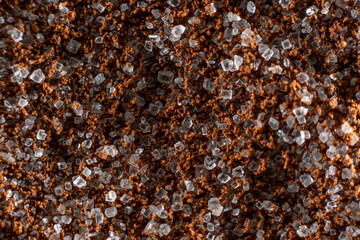 Fullscreen macro close-up with shallow depth of field of sugar mixed with instant coffee. Texture. Graphic design.