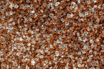 Fullscreen macro close-up with shallow depth of field of sugar mixed with instant coffee. Texture. Graphic design.