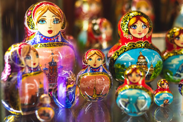 Fototapeta premium Wooden Nesting Dolls or Russian Matryoshka Dolls for sale in St Petersburg, Russia, Matryoshka dolls - traditional Russian souvenirs for foreign tourists