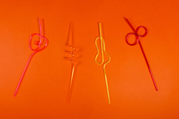 tubes for milk cocktails on an orange background