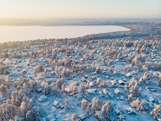 Winter view of russian country suburban village settlement, russian village, aerial sunny drone shot, near Saint-Petersburg